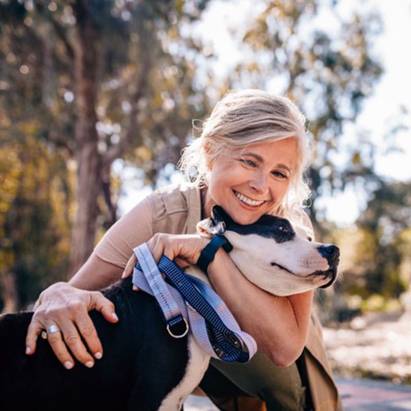 Woman with dog after pain management