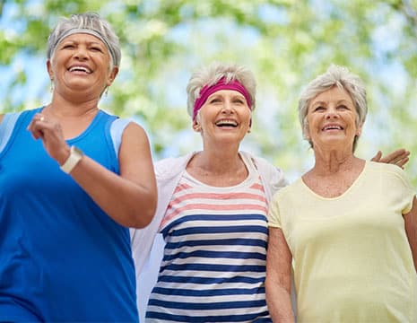 Three Women Walking After Chronic Pain Treatment in Shelby Township MI