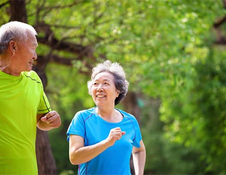 Couple Jogging After Spinal Pain Treatment near Oakland County MI