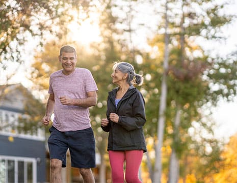 Couple Jogging After Joint Pain Treatment near Macomb Township MI