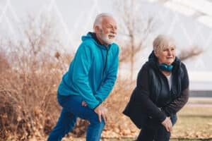 Older Couple Lunging Forward