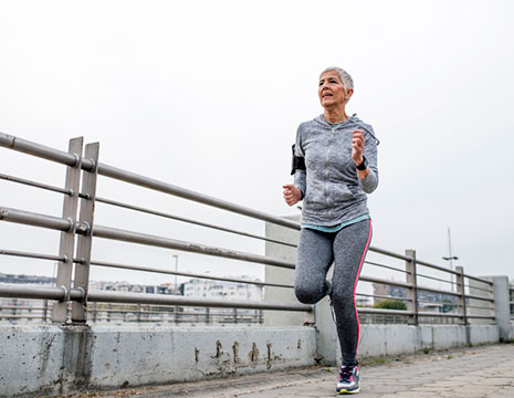 Woman Running After Arthritis Treatment Near Chesterfield, MI