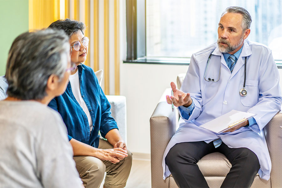 Doctor Discussing with Patients Treatment Options for Joint Pain