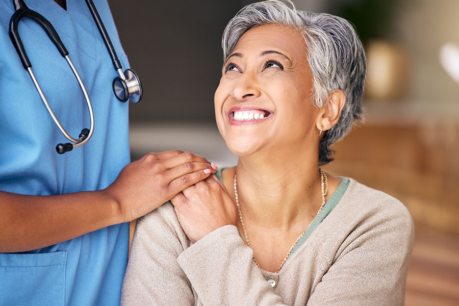 joint-pain-treatment-almont-mi Woman smiling after Joint Pain Treatment near Almont, MI